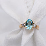Blue Aquamarine and Diamond Ring Set in yellow gold on white material | McLean & Co Jewellers Sunshine Coast