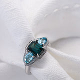 Blue Gemstone Ring with white diamonds and white gold