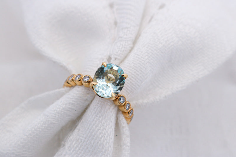 Blue Oval Aquamarine and Diamond Ring Set in Yellow Gold | McLean & Co Jewellers Sunshine Coast