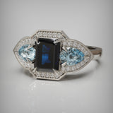 Blue Sapphire and Aquamarine Gemstone ring set with white diamonds surrounding the gems in white gold