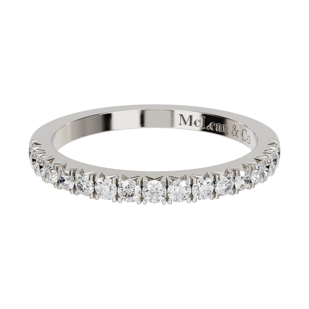 Diamond ring with 'McLean & Co' engraving on a white background