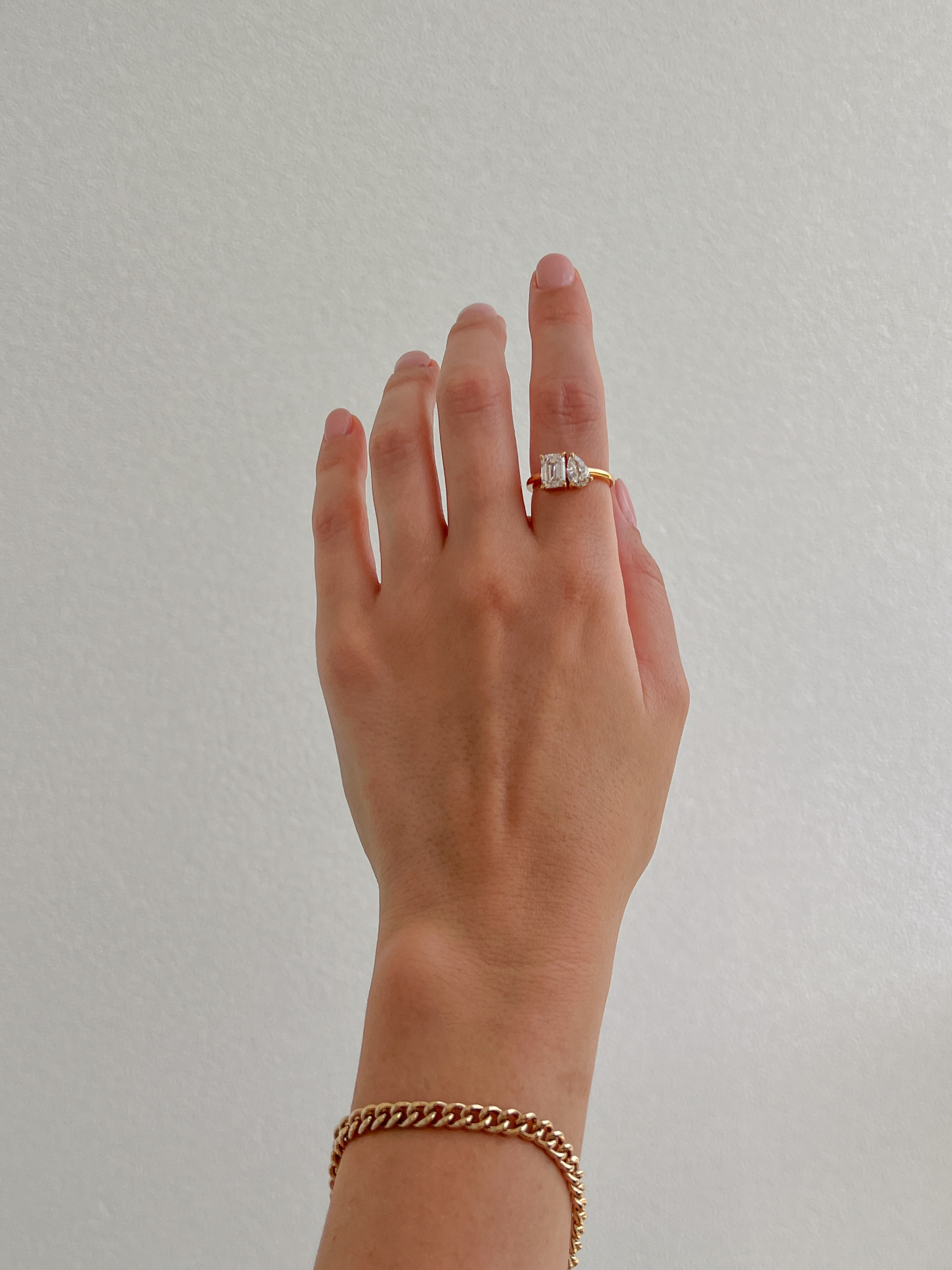 toi et moi engagement ring set in yellow gold with gold bracelet