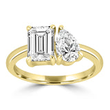 Emerald Cut Diamond and Pear Cut Diamond in Yellow Gold Setting
