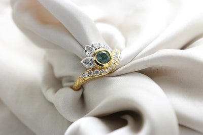 Green Sapphire and diamond ring hand with engraved shoulders