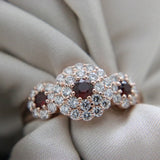 3 Red Round Rubies Halo Diamond Ring  Rose Gold | McLean & Co Sunshine Coast 