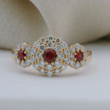 3 Red Round Rubies Halo Diamond Ring set in Rose Gold | McLean & Co Sunshine Coast 