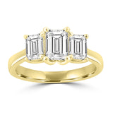 3 stone emerald cut trilogy ring set in yellow gold