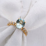 Blue Oval Aquamarine and Diamond Ring Set in Yellow Gold | McLean & Co Jewellers Sunshine Coast