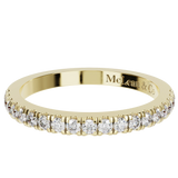 Gold ring with embedded diamonds on a white background