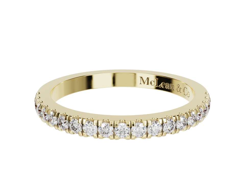 Gold ring with embedded diamonds on a white background