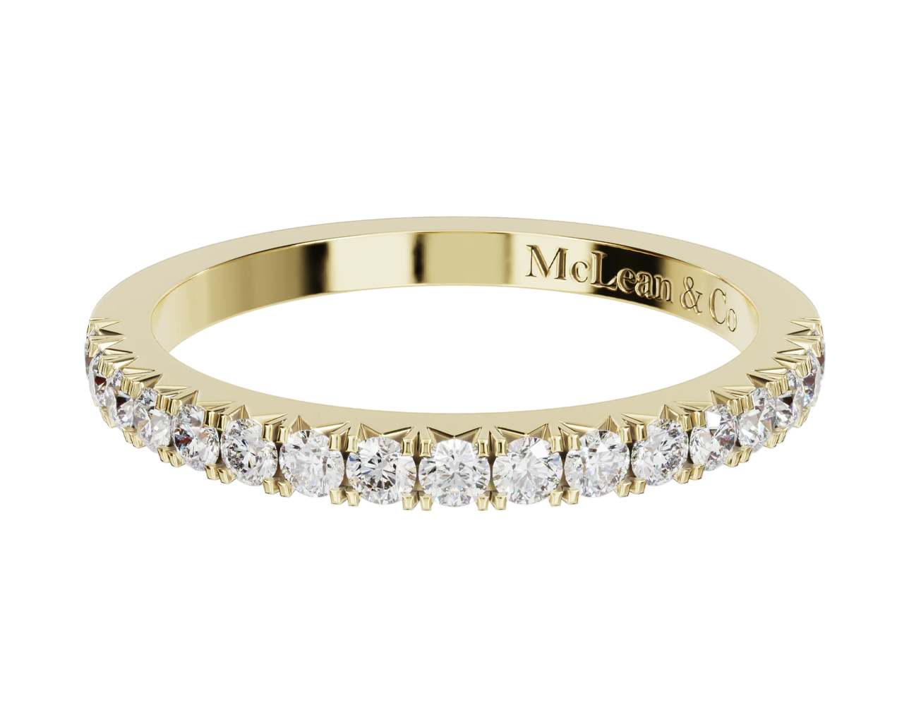 Gold ring with diamonds on a white background, featuring the brand 'McLean & Co'.