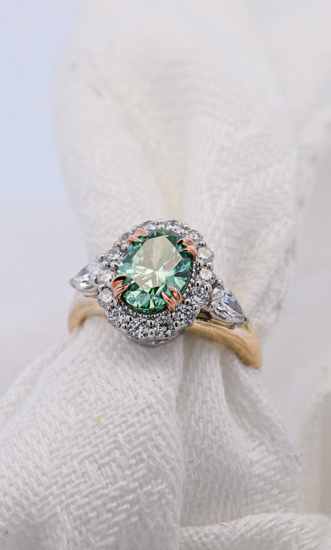 Fancy Style Green Diamond Ring Oval Shape Set with white diamonds in Yellow White and Rose Gold | McLean & Co Jewellers