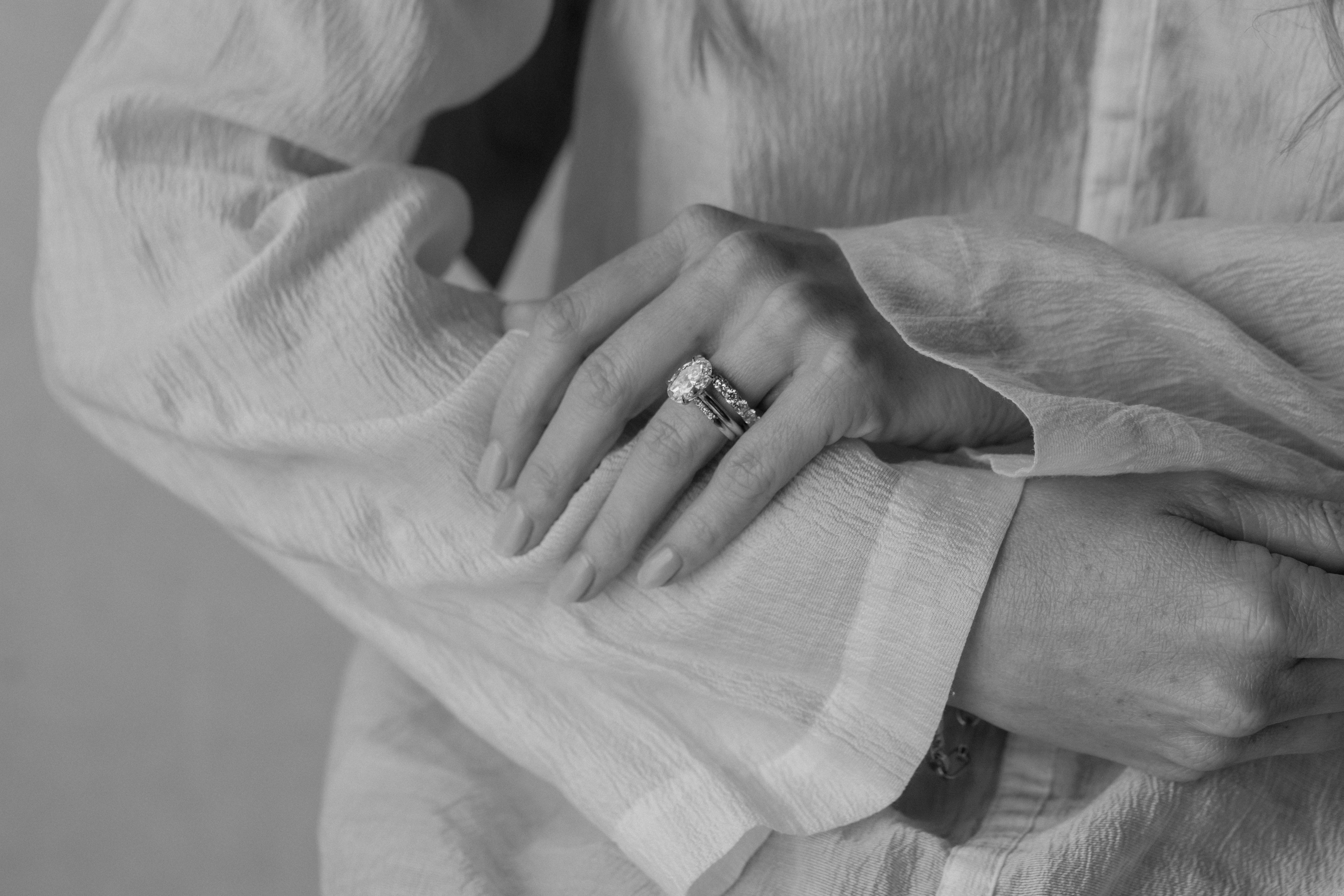 Close-up of a hand wearing a ring with a blurred background