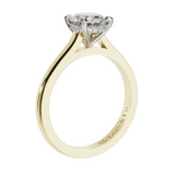 Gold ring with a diamond on a white background
