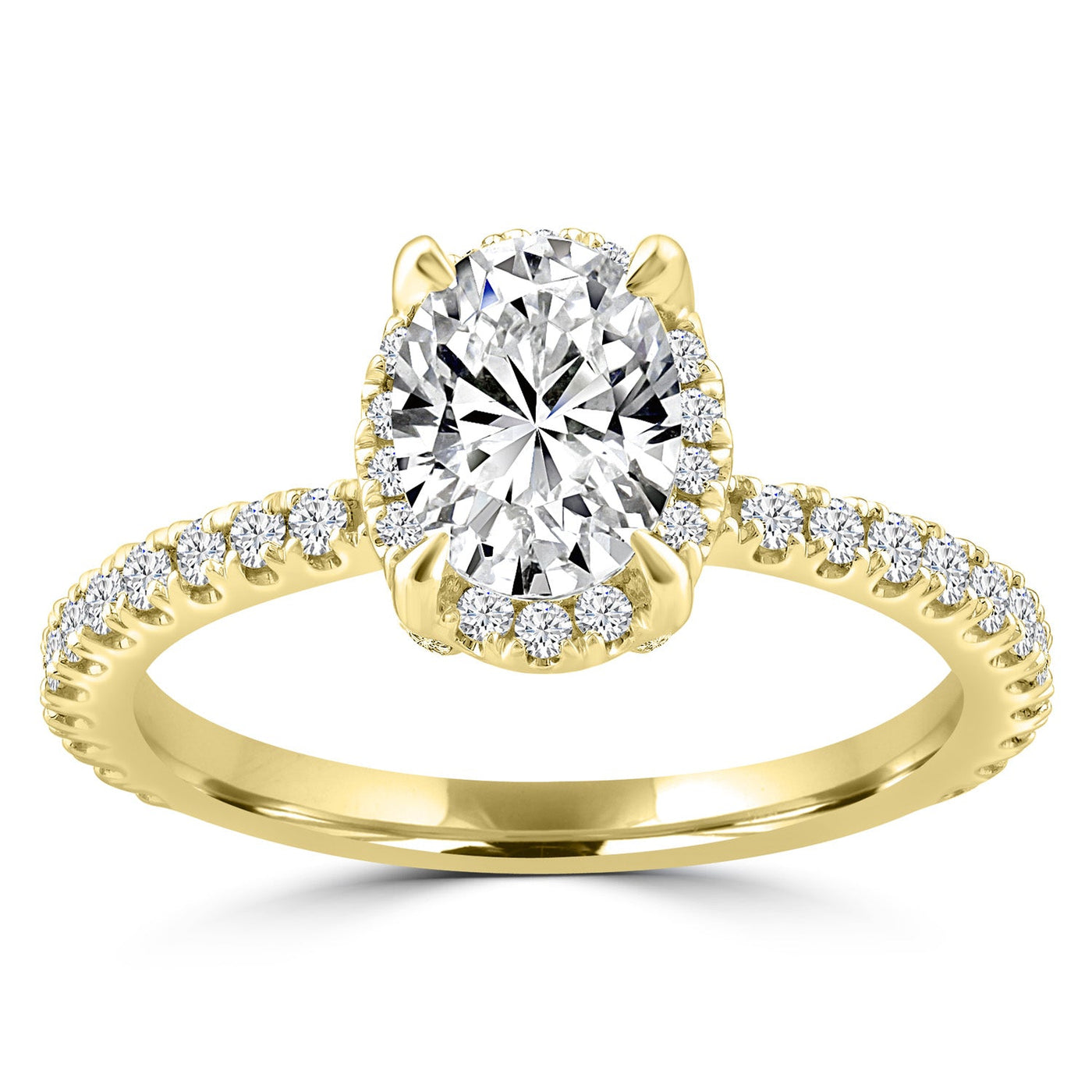 Oval diamond halo engagement ring set in yellow gold with shoulder stones