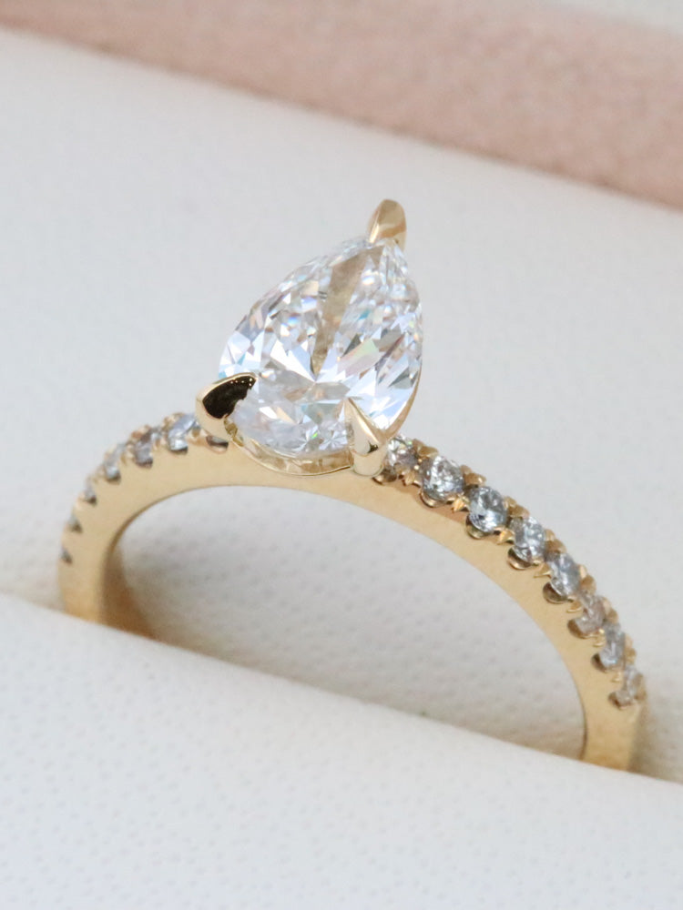Pear shape diamond ring with soulder stones | McLean & Co Jewellers 