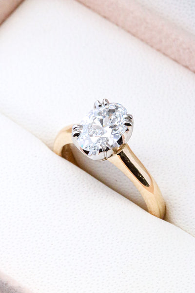 Solitaire Oval Diamond Set in yellow gold thick band 8 double claws 