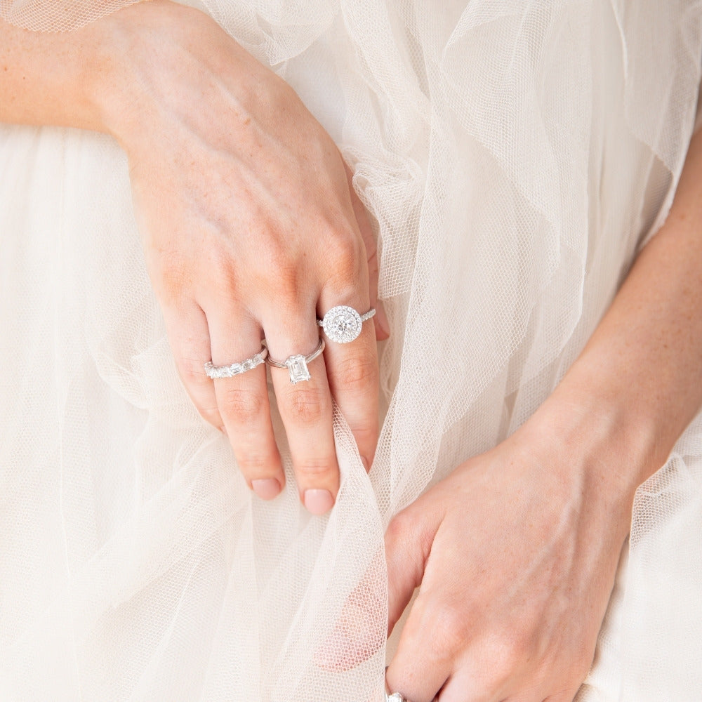 diamond rings on ladies hand tule skirt backdrop
