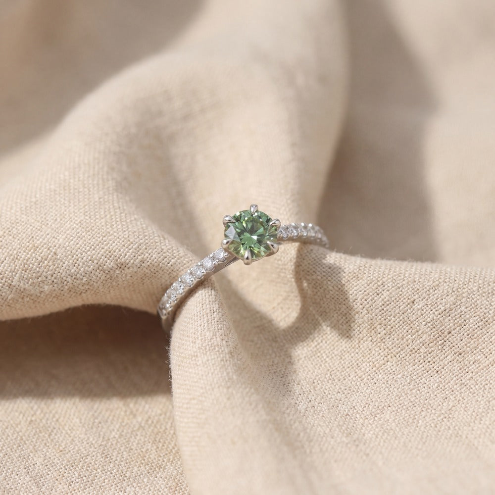 green diamond ring with 6 claws