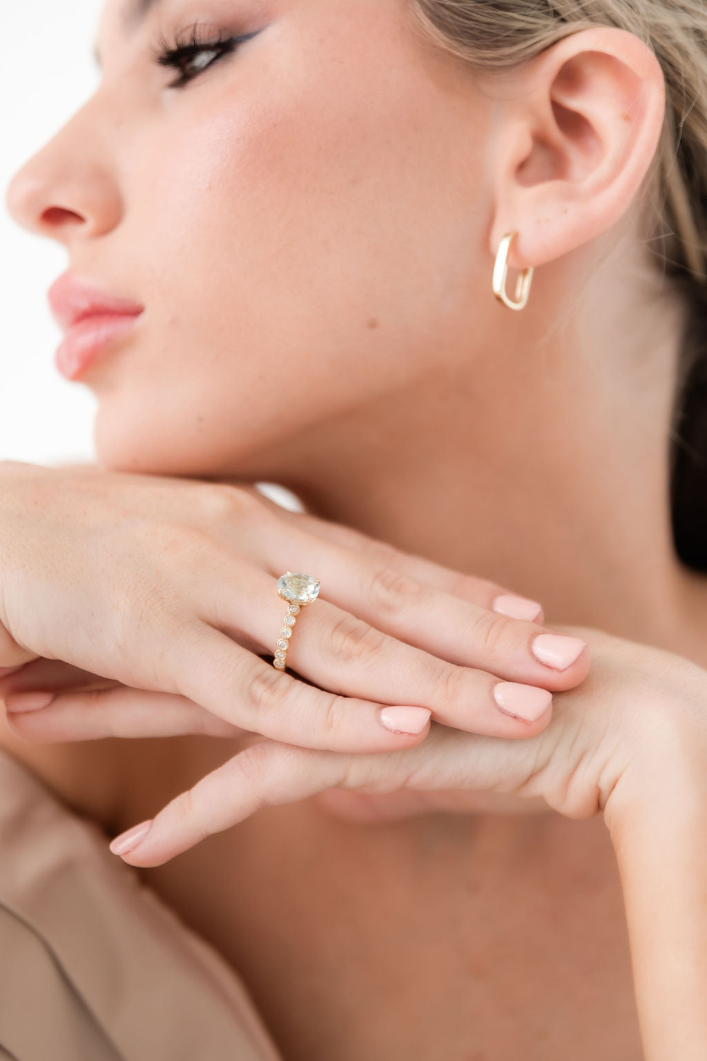 oval aquamarine diamond ring on ladies hand
