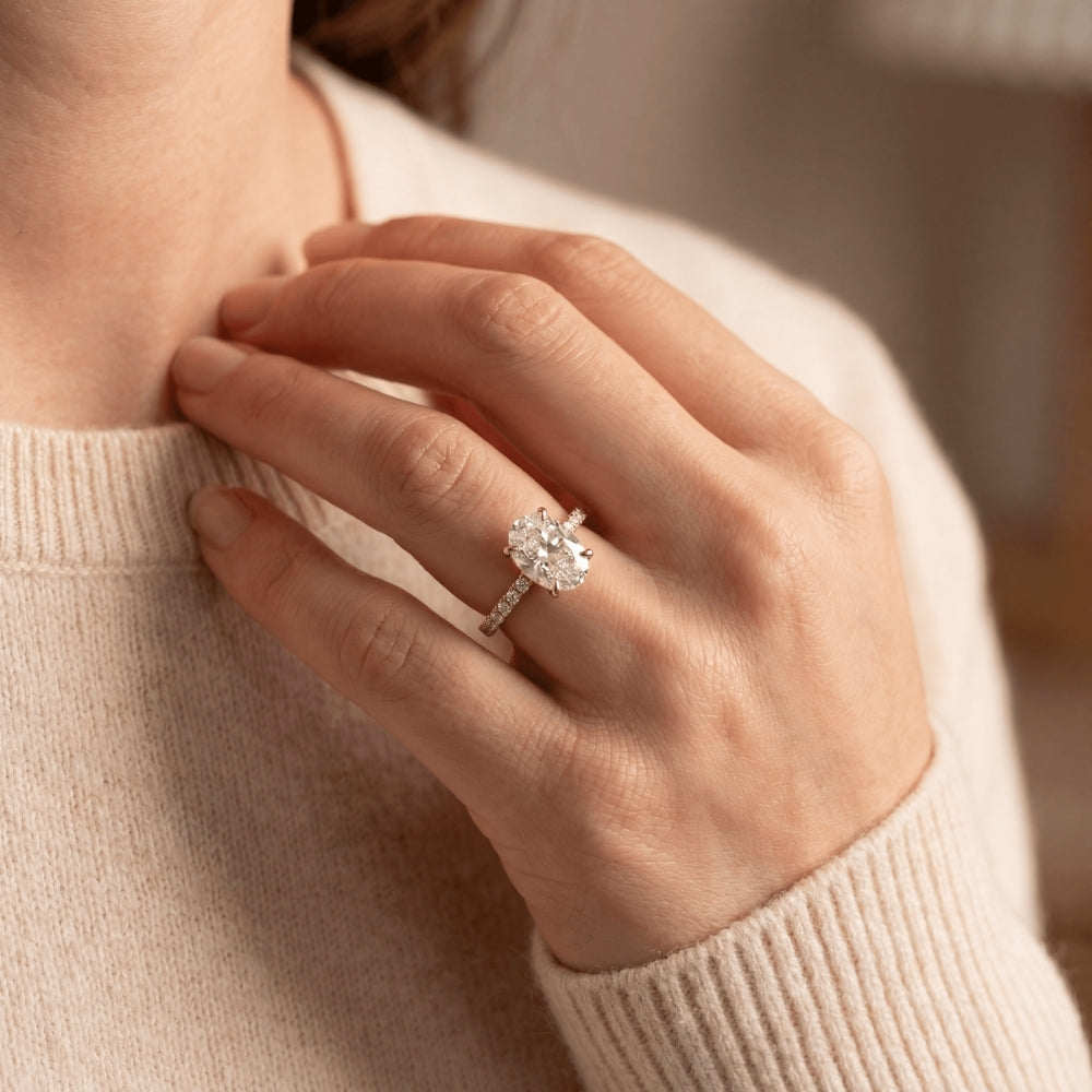 oval diamond engagment ring yellow gold on hand