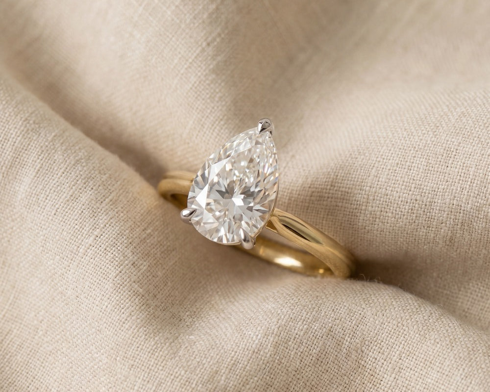 pear cut yellow gold engagement ring 