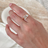 toi et moi engagement ring set in yellow gold on hand